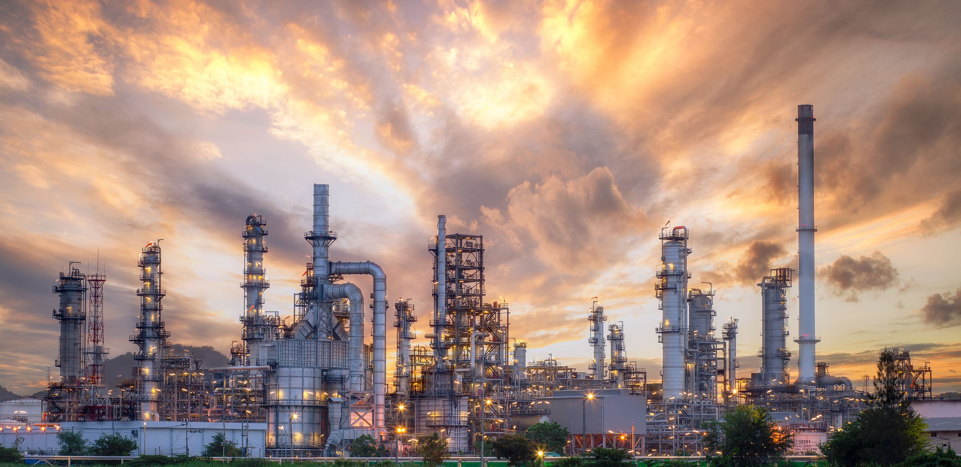 Refinery distillation towers at sunset
